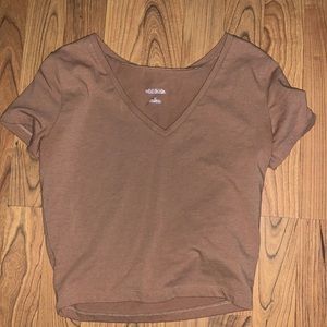 V-neck crop top shirt. Fits like a small but is a medium